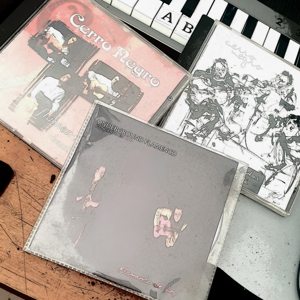 Three CDs from Shane Gonzalez's collection sit on a keyboard, highlighting a creative intersection of music and tech.