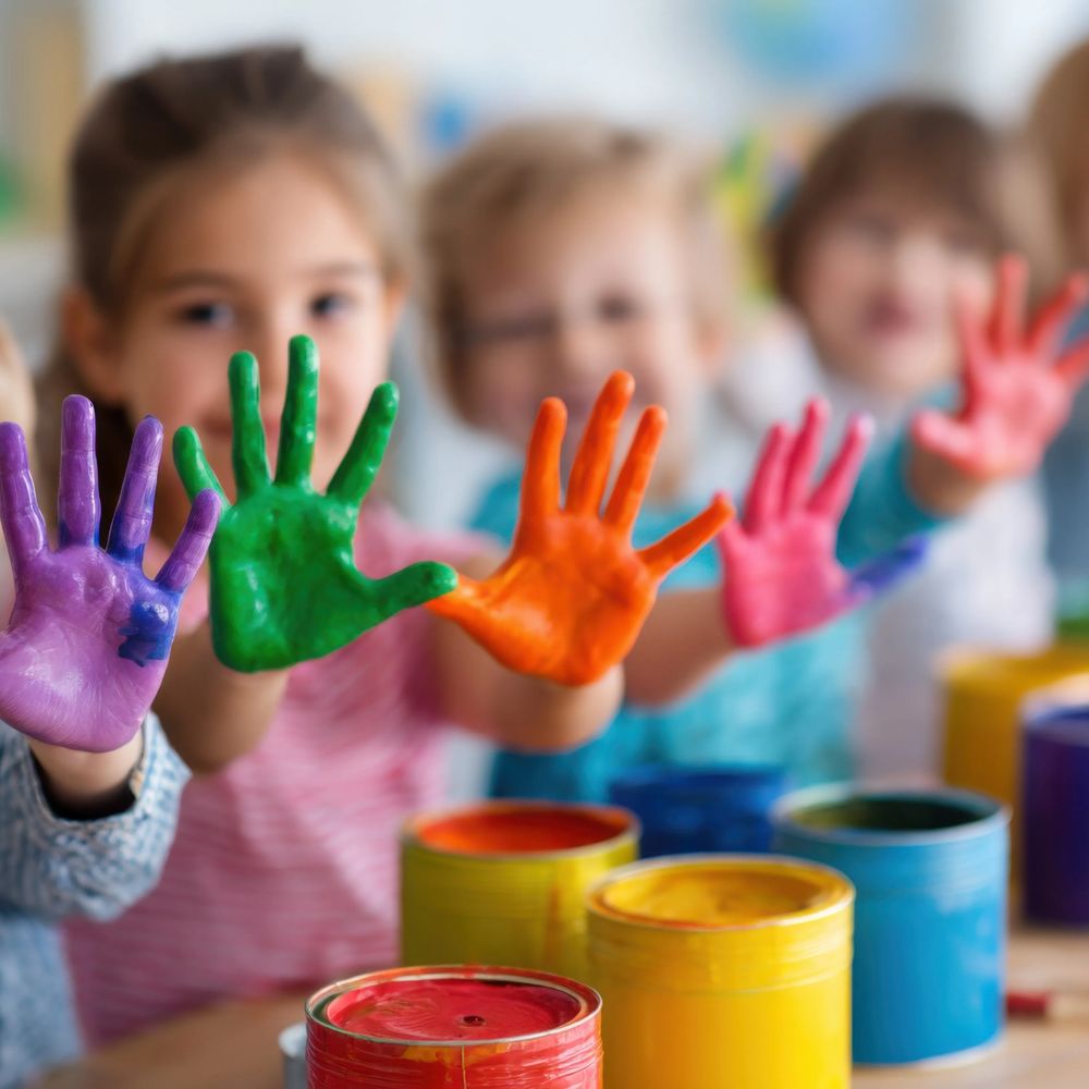 Classroom environment in a school or childcare setting showing children interacting with shared items as part of daily activities, illustrating use cases supported by the ZONO disinfecting an