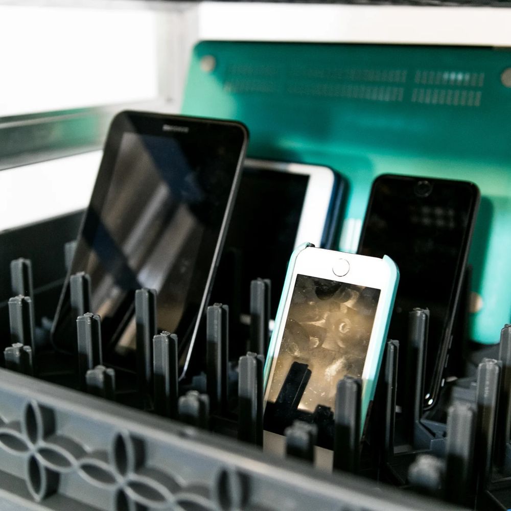 Electronic devices staged in a logistics environment representing ZONO controlled ozone cabinet use in a Fortune 100 distribution operation