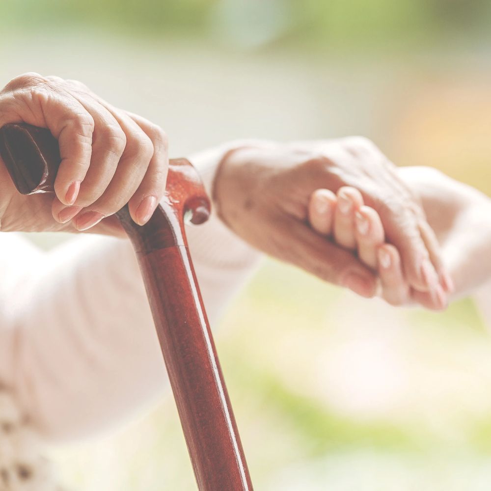 Senior living resident using a mobility aid, representing how ZONO ozone cabinet systems support safer shared environments in senior living facilities