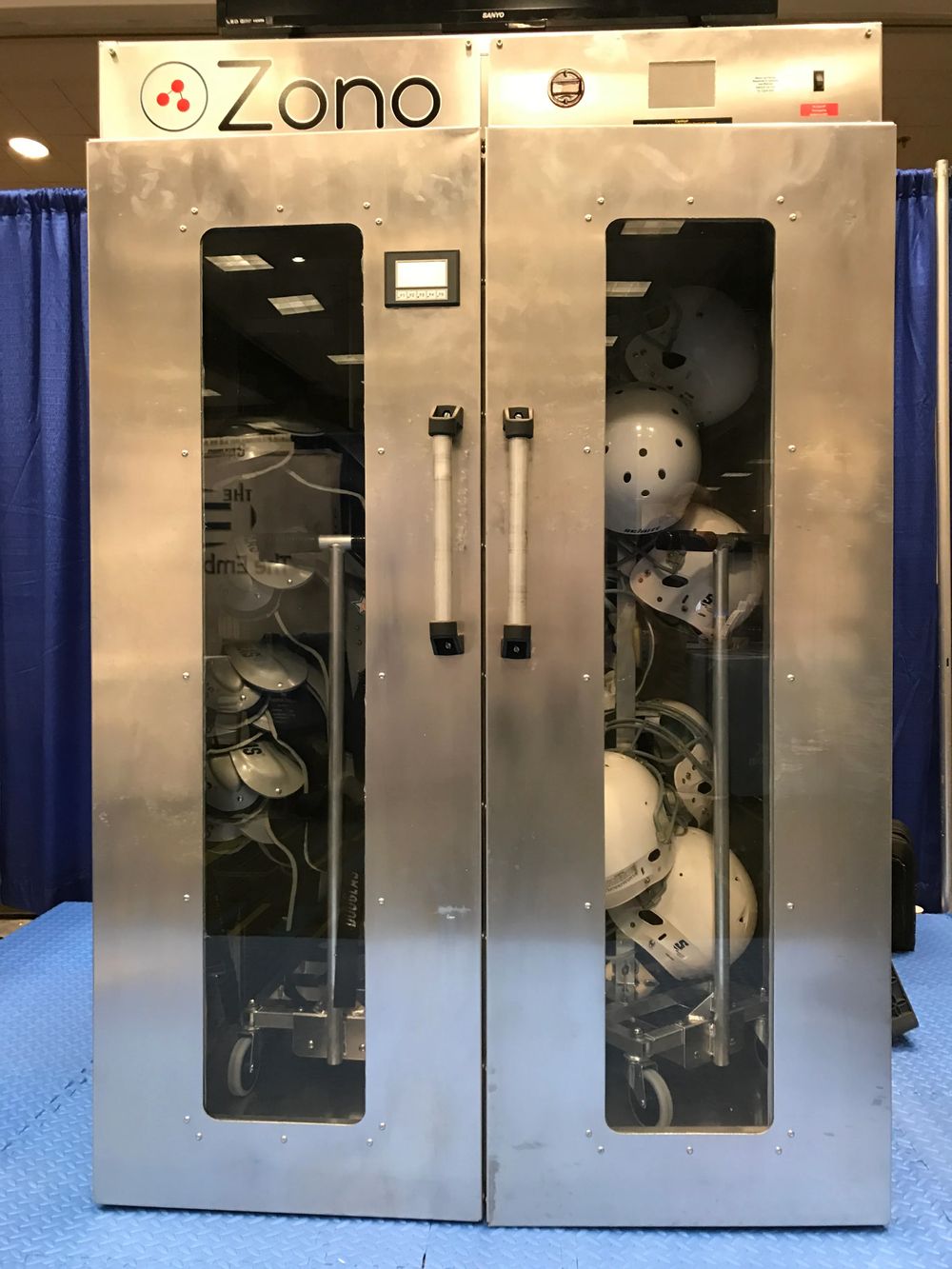 ZONO™ disinfecting and sanitizing cabinet treating athletic helmets and high-touch sports gear using a dry ozone cycle for fitness and athletic environments