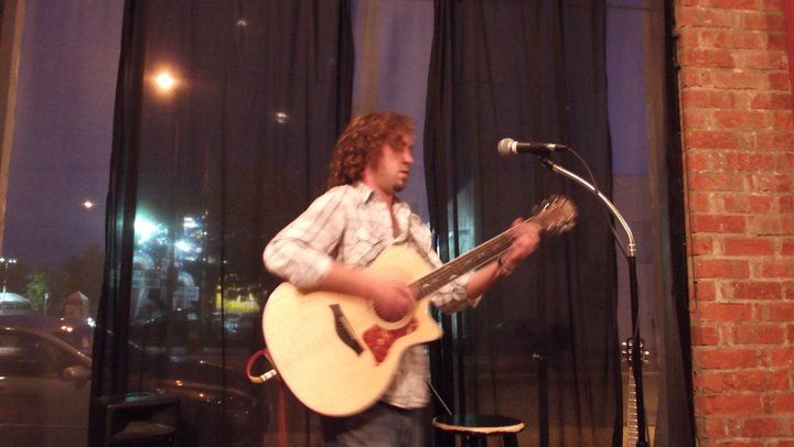 Chris Ingham playing guitar at Cafe Muse, in Los Angeles, 2010.
