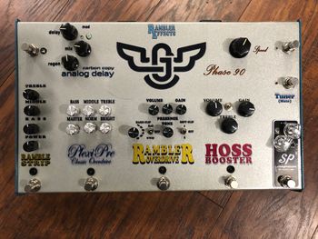 Jack Gregori Custom Rambleboard

This largest project Rambler has ever taken on, I built 4 pedals and rehoused 3 of his existing pedals into a large, pedalboard sized console enclosure along with a PedalPower2 powersupply, which I hardwired each pedal to.  The 4 Rambler pedals are the Rambler Overdrive Deluxe JG Edition, PlexiPre Classic Overdrive, Hoss Booster, and an exclusive Ramble Strip 3-Band active EQ with clean boost.
