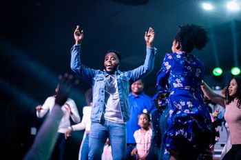 Bj'orn Pierre shares a moment with children on stage at Mirror Man 2: The Concert
