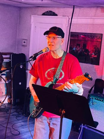 Bill singing & playing guitar
