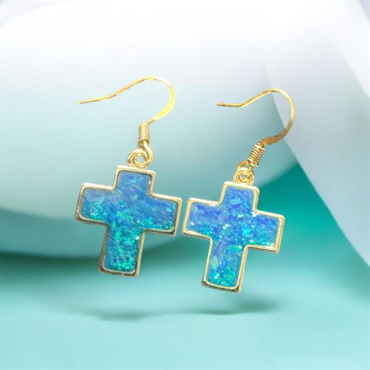 Iridescent blue cross earrings 