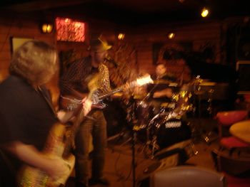 An in motion Oliver Buck & The New Madrids at the Barking Spider, late 2000's
