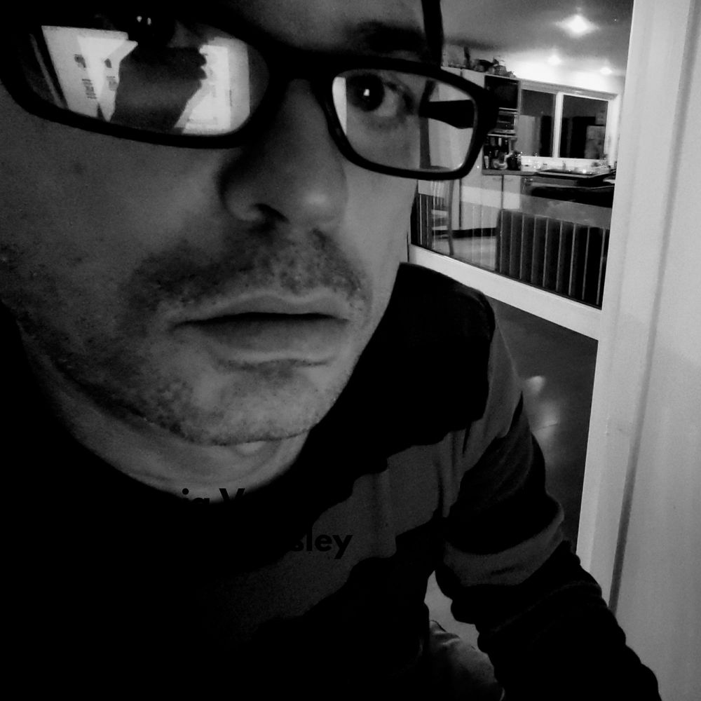 Marc Beasley black and white close up with glasses