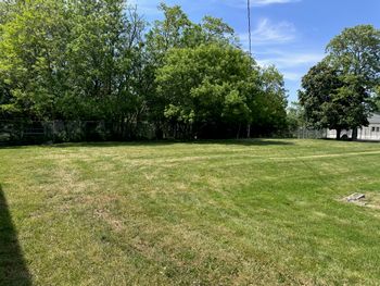 Fully fenced 1/2 acre play yard. Surrounded by mature shade trees.
