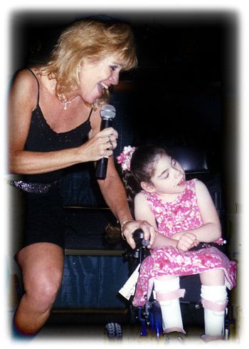 “We told all of Livvie’s therapists at Easter Seals how you danced with her in her chair and how much she recognized,
“I Hope You Dance” as “her song” as soon as it began.”
