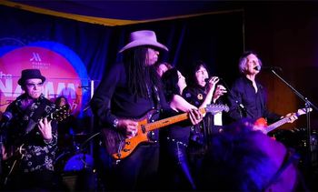 Angel on stage with Larry Mitchell and an awful lot of Grammys!
