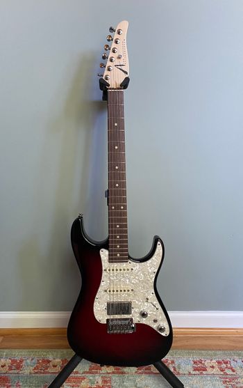 Tom Anderson "The Classic" — Transparent Red to Black Burst.
https://www.andersonguitarworks.com

