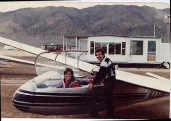 I'm sitting in the rear seat, partially hidden. The glider is a L-13 Blaník, a two-seater trainer glider. We are at the Air Sailing glider port in Reno, NV. Time frame is in the mid 1980's.
