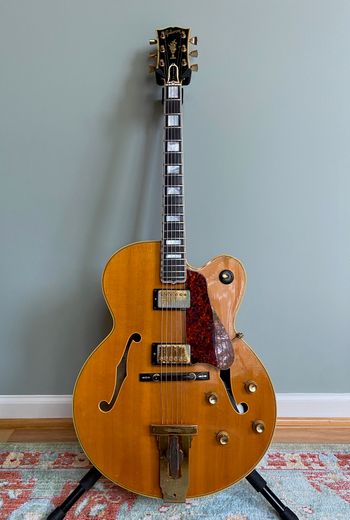 Gibson L-5 CES, c. 1971 — Natural blonde carved archtop, dual humbuckers, gold hardware, split-block inlays.
