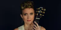 Christie Lenee -moved to larger venue
