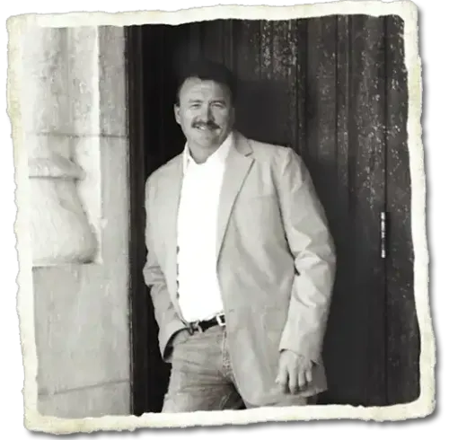 Photo of Darrell leaning on wall