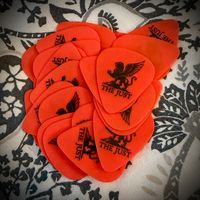 The Just Logo Guitar Picks – Orange 5 Pack (0.60mm)