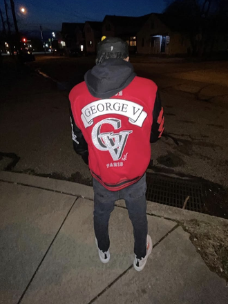 2TK wearing varsity jacket