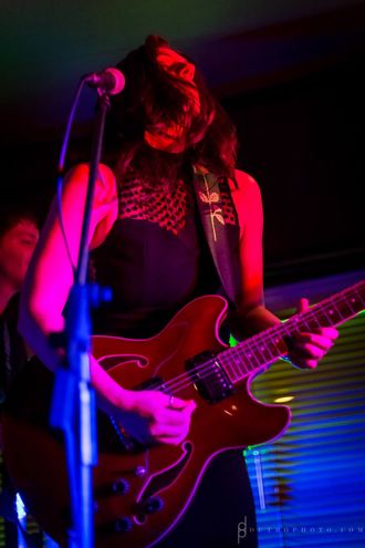 maria sierra playing electric guitar