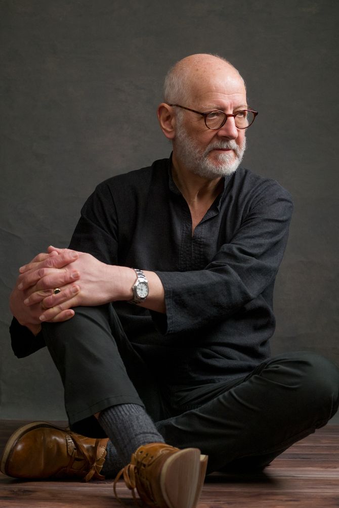 Singer-songwriter Brandes, seated cross-legged, looks to the right in a colour portrait by Anastasia Jobson.