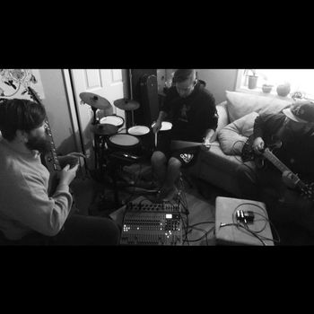 Troy, DJ, and Keegan along with Adrian (taking the photo) practicing in the band that almost was, "Padden Parkway" in 2020.

