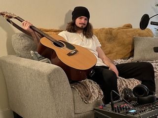 Adrian posing for a quick photo after playing "SCORPIO" under the alias "Slug Plug" in 2024.
