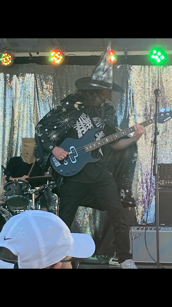 Adrian on stage at Ilani Casino Resort playing bass guitar with Logan and Tyler from "Descent of a Tyrant" in 2021.
