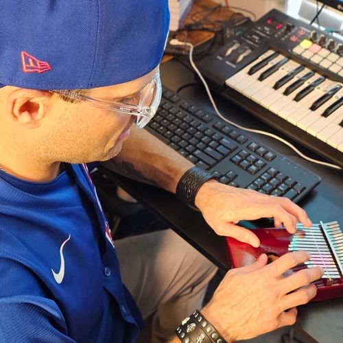 Logan Kimball - Chicago Music Producer - Hip-Hop, Pop, EDM, Rock, Instrumentals - Dark North Productions, Playing the Kalimba