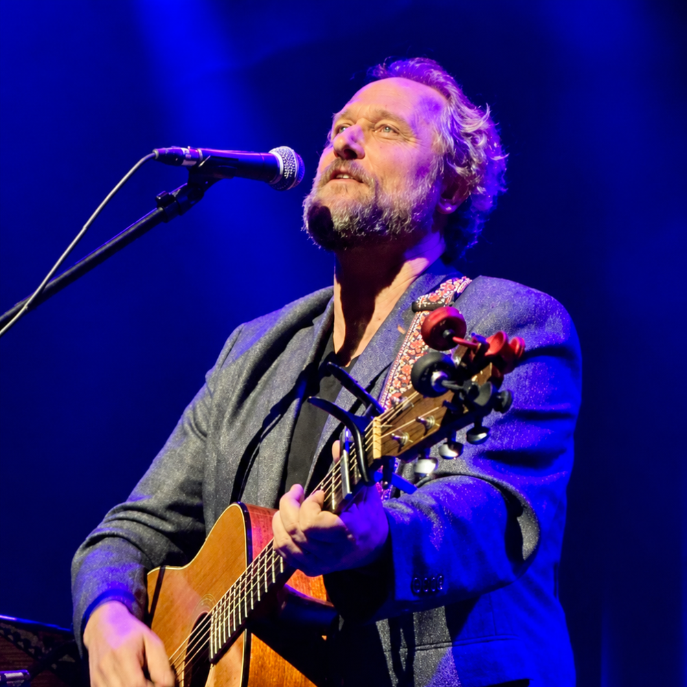 Craig Cardiff playing a guitar