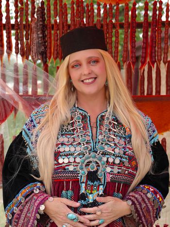 Kimberly Cofer promotional shot at a roadside churchkhela stand in Kakheti, Georgia. Photo credit: Nini Mamulaidze
