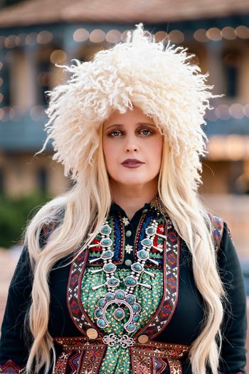 Kimberly Cofer promotional shot in traditional Khevsuretian attire in Old Tbilisi. Photo credit: Inna Davidoff
