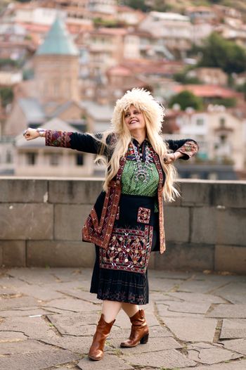 Kimberly Cofer promotional shot in traditional Khevsuretian attire in Old Tbilisi. Photo credit: Inna Davidoff
