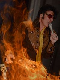 Anthony Liguori as Elvis