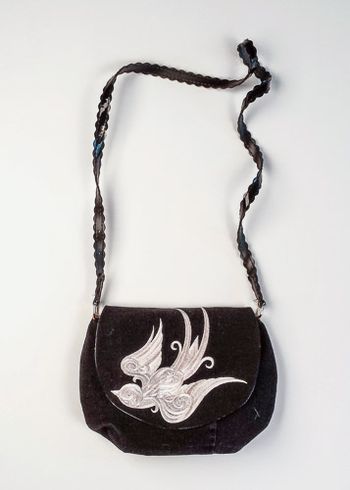 Baroque Punk Swallow embroidered on upcycled denim. The strap is a belt.
