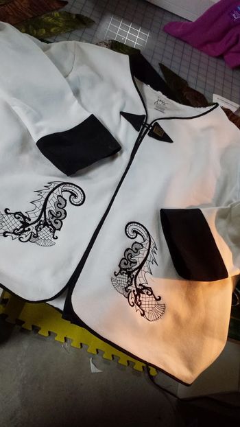 upcycled sweatshirt with embroidered thistle on the front bottom and on the back of the cardigan
