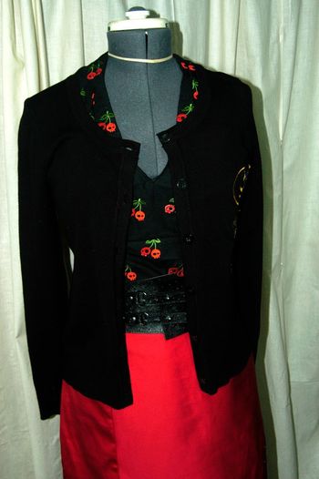 Red cherries are actually skulls and all embroidered on the fabric before cutting it out and sewn.
