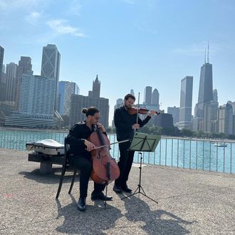 Parkwest Strings string duo providing elegant live music for a small ceremony, two musicians performing with intimacy and clarity.