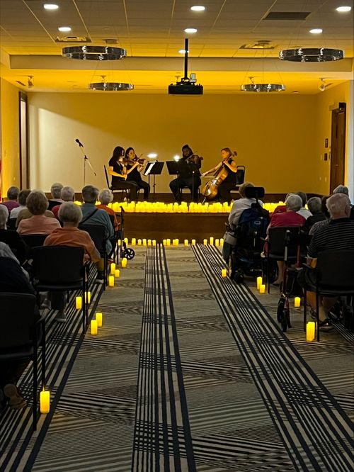 String quartet performing a one-hour live concert for a listening audience