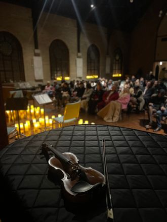 view of audience and violin during a string quartet valentine's day concert