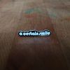 "A Certain Smile, A Certain Sadness" Pins