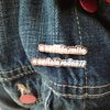 "A Certain Smile, A Certain Sadness" Pins