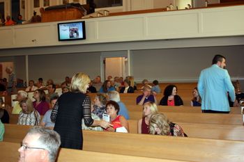 Crowd arriving and anxiously awaiting the concert.
