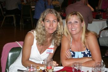 Caroline Sommers and Peggy Moore watching Harold Flowers drink Red Cat.
