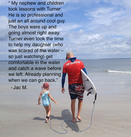 Child learning to surf with guidance from Tybee Surf Lessons coach