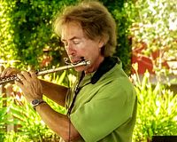 Bryan Savage performs at Los Arroyos Pool Party