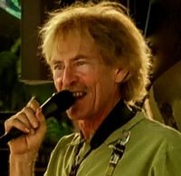 Bryan Savage performs at Los Arroyos Pool Party