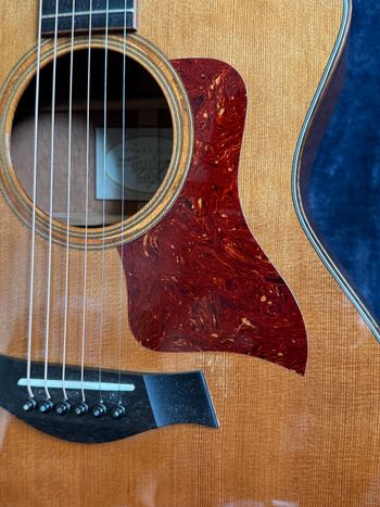 Original pick guard.  Slight wear on the guitar near the back of the guard.
