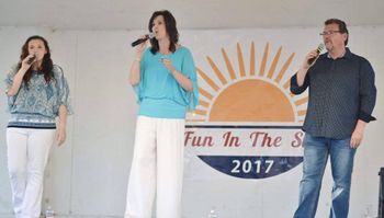 Singing at the "Clarence Homecoming" outdoor festival

