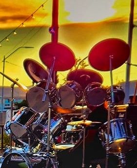 Midnight Rebel drummer James Ludwig Leece at sunset rocking the crowd
