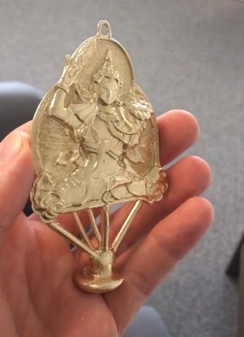 And the final piece with the 'tree' still attached. The tree is an impression of the channels of the mold left behind from where the liquid gold is inlet.
